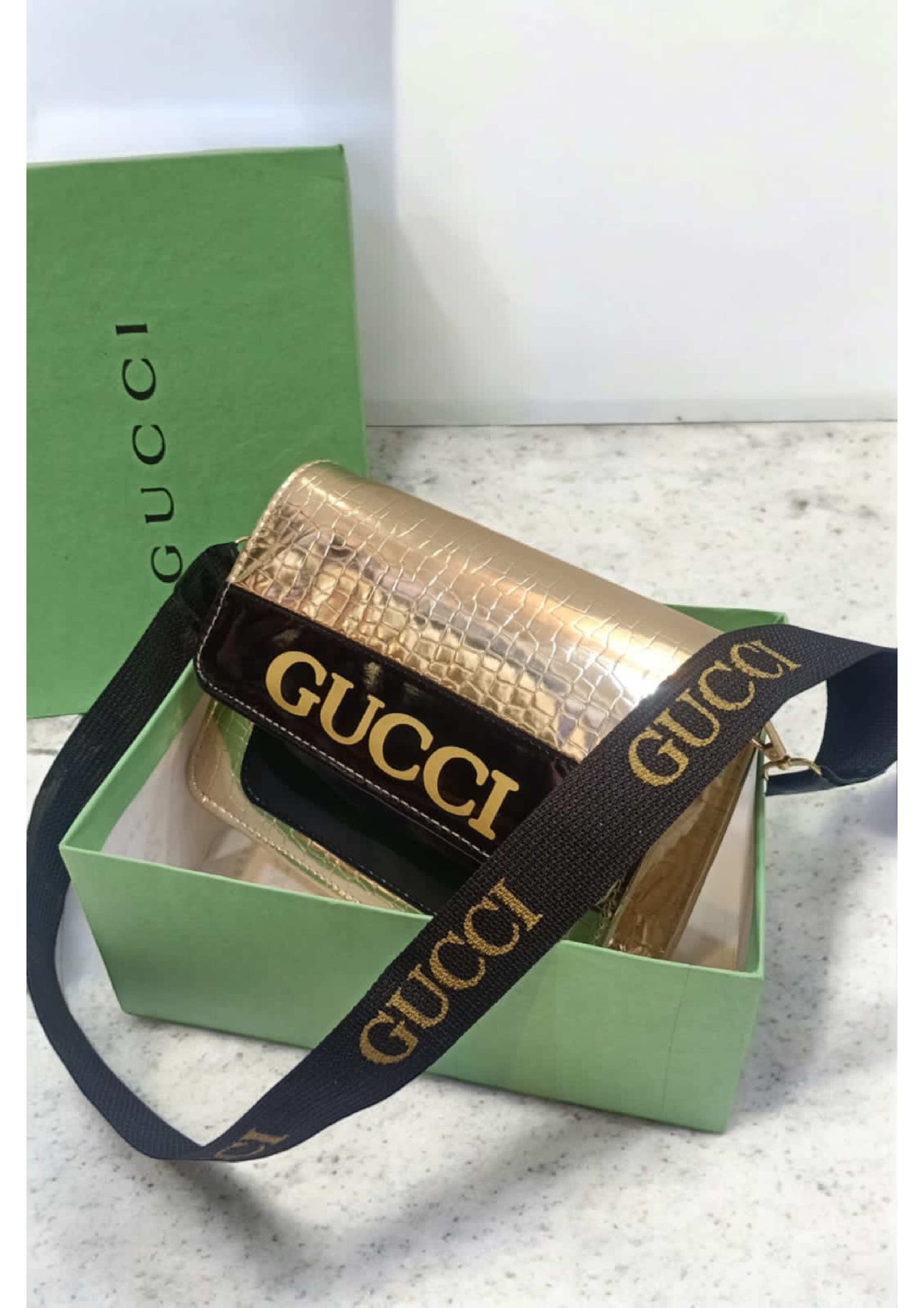 GUCCI GOLD & BLACK PIECE CROSS BODY BAG
